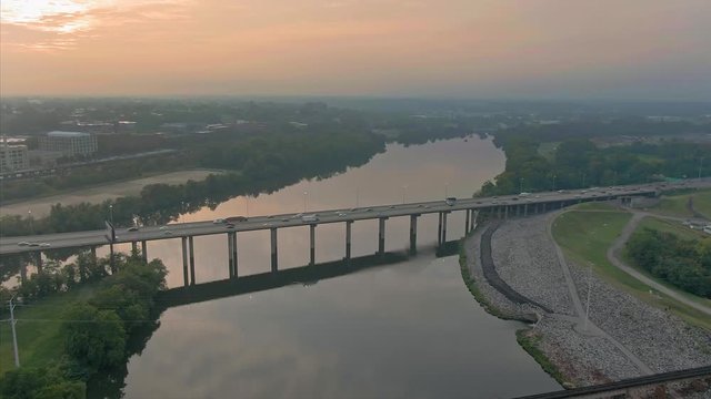 Aerial: Bridge traffic crossing the James River. Richmond, Virginia, USA