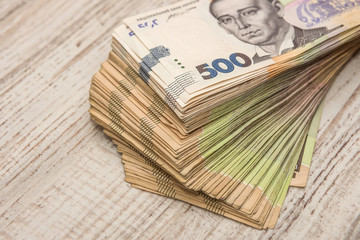 500 uah bundle of Hryvnia on desk. save