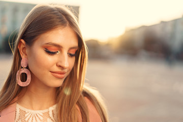 Close up portrait of a woman walking in the street