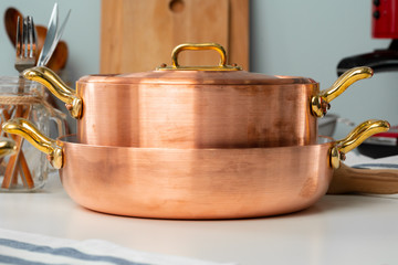 Close up of modern kitchen interior with copper cookware
