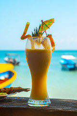 A yellow cocktail on Cocalito Beach in Punta de Sal in the Caribbean Sea, Tela. Honduras