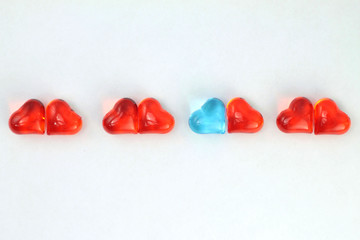 Blue and red glass hearts  on white background. Stock photo for Valentine's Day with empty place...