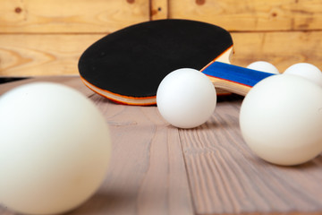 Ping pong equipment on wooden table close up