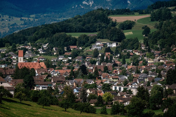 Fototapeta na wymiar Summer view of a beautiful apline village in Switzerland
