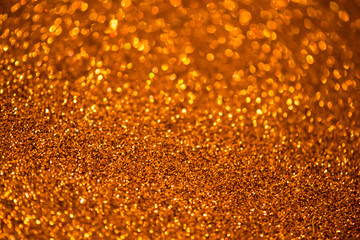 Golden abstract background with bokeh defocused lights