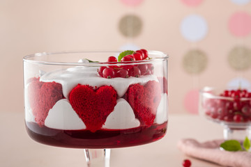 Red velvet cake in glasses for valentines day on a pink background. Valentine day.