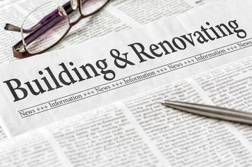 A newspaper with the headline Building and Renovating
