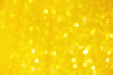 Yellow sparkle bokeh glitter abstract on christmas gold colorful background