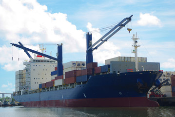 Container ship with own cranes make loading and discharging of reefer containers at the Brazilian...