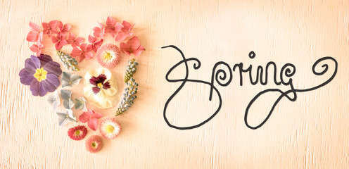 Notalgic Wooden Background With English Calligraphy Spring. Colorful Spring Flower Blossoms Heart
