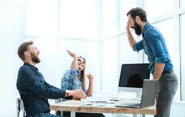 satisfied employees giving each other a high five