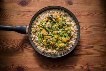 Moroccan couscous with vegetables in a wooden table