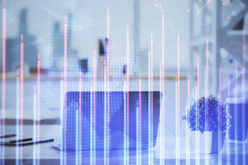 Stock market graph and table with computer background. Double exposure. Concept of financial analysis.