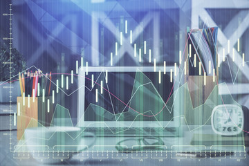 Multi exposure of graph and financial info and work space with computer background. Concept of international online trading.