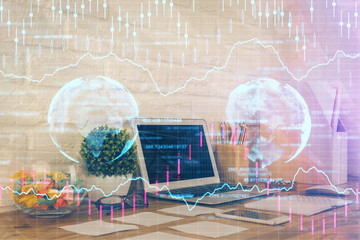 Stock market graph and table with computer background. Multi exposure. Concept of financial analysis.