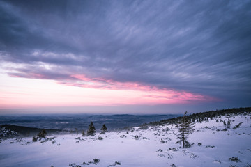 Winter landscape in Krkonose, after sunset beautifully painted landscape in shades of blue and pink color. Krkonose National Park, Czech Republic. Giant Mountain.
