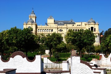 View of the Pedro Luis Alonso gardens with the city hall to the rear, Malaga, Spain.