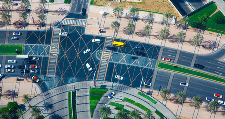 aerial view of intersection with car traffic in the city