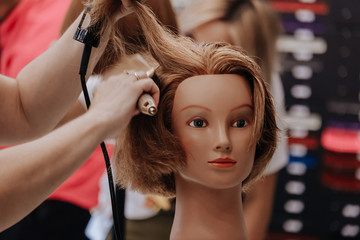 Training hair styling on a mannequin