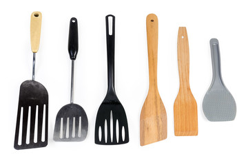 Different kitchen spatulas on a white background