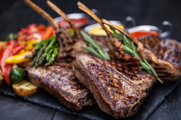 grilled set of steaks, t-bone and vegetables