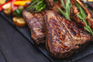 grilled set of steaks, t-bone and vegetables