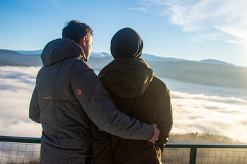 Holidays in the mountains. Young attractive gay couple.