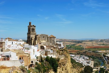 Fototapeta na wymiar View of St Peters church and town buildings, Arcos de la Frontera, Spain.