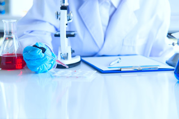 science medical study phamasutical medicine lab in hospital. scientist doing some research vaccine anti virus sample.technology medical of chemist  scientist working with microscope ware glass safty.