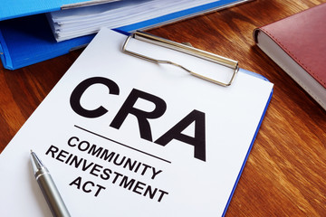 Community Reinvestment Act CRA in the blue clipboard. - obrazy, fototapety, plakaty