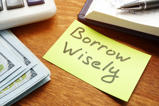 Borrow Wisely sign and money. Choose loan concept.