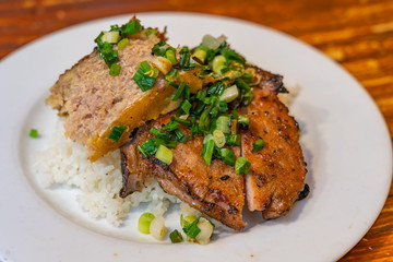 Plate of delicious Vietnam flavored grilled pork chop white rice