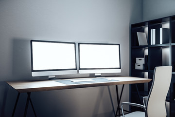 Designer desktop with two empty computer screen