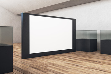 Blank banner on black wall and aquariums