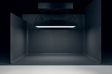 Photo studio with lighting equipment and black background - obrazy, fototapety, plakaty
