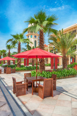 Fototapeta premium The sitting area with sunshades and tables in a small street park,Fuzhou,Fujian,China