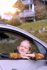 girl looking out the car