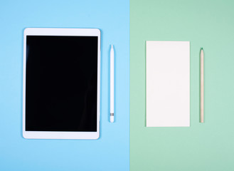 Modern tablet and a paper Notepad with a pencil. The concept of a digital detox.