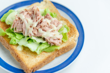 Club sandwich with cheese, cucumber, tomato, ham and eggs. Top view