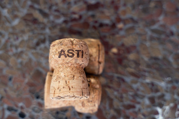 the group of champagne corks on cracked glass table. Flat lay.