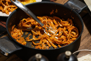 Tagliatelle Pasta with Tomato Sauce Parmesan Basil in Pan.