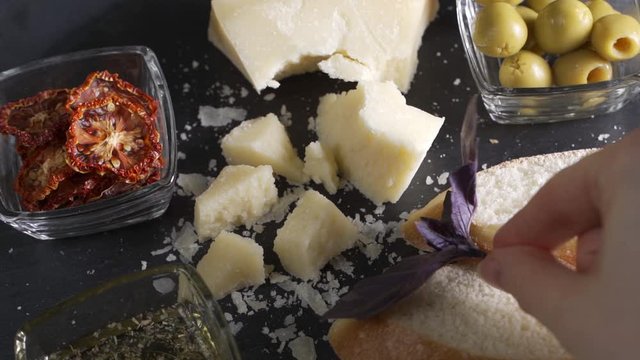 Video of Traditional italian food - parmesan cheese, dried tomato and olive