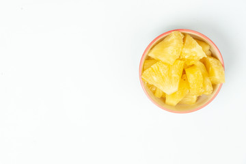  Pineapple in a bowl on the table top view background 