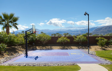 Empty basketball court with light pole © MDBPIXS