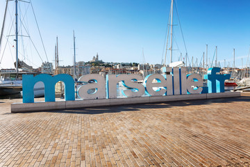 Tourist embankment in the old port of Marseille on a sunny day.