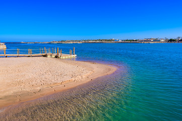 Relaxing at beach with pier at white beach - travel destination for vacation - Hurghada, Red Sea, Egypt