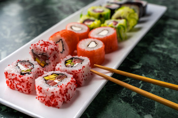 Fresh made sushi set on white plate