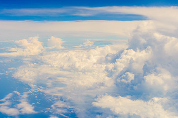 Obraz na płótnie Canvas View of clouds and sky from airplane window