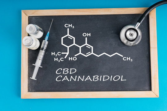 Cannabidiol molecule formula on the chalkboard.