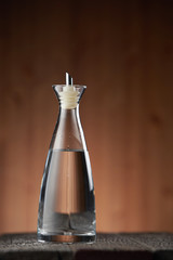 white vinegar on the wooden table top